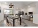 Dining area with modern light fixture, table with seating and open kitchen and living space at 8255 N 22Nd Dr, Phoenix, AZ 85021