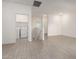 Bright open living space featuring neutral paint, tile floors, and laundry area at 8255 N 22Nd Dr, Phoenix, AZ 85021