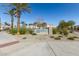 Community sign '23 North' surrounded by green landscaping, tall palm trees, and community amenities at 8255 N 22Nd Dr, Phoenix, AZ 85021