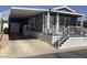 Exterior view of the home showing a covered parking area and front entrance at 8700 E University Dr # 1610, Mesa, AZ 85207