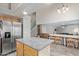 Spacious kitchen featuring granite counters and a stainless steel refrigerator at 937 E Rosebud Dr, San Tan Valley, AZ 85143