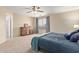 Main bedroom with natural light, neutral walls, and dresser at 937 E Rosebud Dr, San Tan Valley, AZ 85143