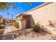 Charming exterior with gated entry, well-maintained landscaping, and a covered patio area at 95 N Cooper Rd # 68, Chandler, AZ 85225