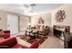 Cozy living room featuring a fireplace, tile flooring, and neutral color palette at 95 N Cooper Rd # 68, Chandler, AZ 85225