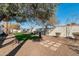 Landscaped backyard with gravel, artificial turf, stepping stones, desert plants and privacy fence at 9821 N 29Th Pl, Phoenix, AZ 85028