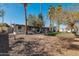 View of the backyard with desert landscaping and gray exterior of the house at 9821 N 29Th Pl, Phoenix, AZ 85028