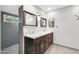 Bathroom featuring a double vanity with marble countertops and modern fixtures at 9821 N 29Th Pl, Phoenix, AZ 85028