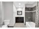 Well-lit bathroom with vanity and gray tiled shower and tub at 9821 N 29Th Pl, Phoenix, AZ 85028