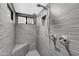 Modern bathroom featuring a walk-in shower with dual showerheads and a built-in bench at 9821 N 29Th Pl, Phoenix, AZ 85028