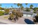 Aerial view of home with a three car garage, new roof, and desert landscaping at 9821 N 29Th Pl, Phoenix, AZ 85028