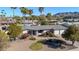 Aerial view of desert landscaped home with three car garage, new roof and stone pathway at 9821 N 29Th Pl, Phoenix, AZ 85028