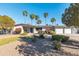 Charming single-story home with desert landscaping, palm trees, and brick accents at 9821 N 29Th Pl, Phoenix, AZ 85028