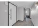 Hallway shows view of the home's entryway and doorway to the left at 9821 N 29Th Pl, Phoenix, AZ 85028