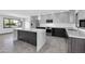 Modern kitchen featuring gray cabinets, stainless steel appliances, and a large marble island at 9821 N 29Th Pl, Phoenix, AZ 85028
