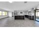 Modern kitchen with stainless steel appliances, sleek gray cabinets, and a central island at 9821 N 29Th Pl, Phoenix, AZ 85028