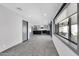 Open concept kitchen and dining area with stylish new flooring, natural light and stainless appliances at 9821 N 29Th Pl, Phoenix, AZ 85028