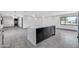 Modern kitchen with stainless steel appliances, a gray island, and stylish gray tile flooring at 9821 N 29Th Pl, Phoenix, AZ 85028