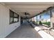 Covered patio with ceiling fans, large windows, and tile flooring at 9821 N 29Th Pl, Phoenix, AZ 85028