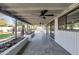 Extended covered patio with fans, neutral tiling, desert plants, and access to home at 9821 N 29Th Pl, Phoenix, AZ 85028