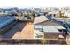 Aerial view of a house showing a large, enclosed backyard with a patio and fire pit in a residential neighborhood at 10309 E Supernova Dr, Mesa, AZ 85212