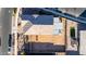 Aerial view of the property shows a large roof, enclosed backyard with patio and fire pit in a residential neighborhood at 10309 E Supernova Dr, Mesa, AZ 85212