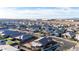 Scenic aerial shot displaying a modern residential area with homes and an industrial area in the background at 10309 E Supernova Dr, Mesa, AZ 85212