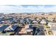 Wide aerial view highlighting a modern community with residential homes and open land at 10309 E Supernova Dr, Mesa, AZ 85212