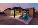 Backyard showing a covered patio, a fire pit, and outdoor seating, ready for entertaining at 10309 E Supernova Dr, Mesa, AZ 85212