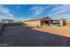 Expansive backyard with a covered patio and ample space for outdoor activities and potential landscaping at 10309 E Supernova Dr, Mesa, AZ 85212