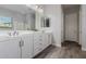 Bright bathroom features a double sink vanity with white cabinets and contemporary fixtures at 10309 E Supernova Dr, Mesa, AZ 85212