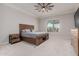 Primary bedroom with a ceiling fan and ensuite bath at 10309 E Supernova Dr, Mesa, AZ 85212