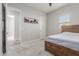 Bright bedroom features a comfortable bed, carpeted floor, and natural light from a window at 10309 E Supernova Dr, Mesa, AZ 85212