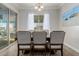 Formal dining area with wood table, upholstered chairs, and stylish decor at 10309 E Supernova Dr, Mesa, AZ 85212