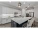Elegant kitchen featuring white cabinetry, stainless steel appliances, and quartz countertops at 10309 E Supernova Dr, Mesa, AZ 85212
