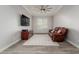 Living room with hardwood style flooring, a plush sofa, a ceiling fan, and TV at 10309 E Supernova Dr, Mesa, AZ 85212