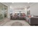 Open floor plan with a plush sectional sofa and decor pillows at 10309 E Supernova Dr, Mesa, AZ 85212