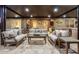 Spacious covered patio featuring comfortable seating and a built-in outdoor kitchen, perfect for entertaining at 10309 E Supernova Dr, Mesa, AZ 85212
