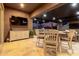 Exterior space showcasing a dining area and entertainment setup, perfect for outdoor enjoyment at 10309 E Supernova Dr, Mesa, AZ 85212