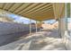 Covered back patio with concrete and gravel, perfect for entertaining and low maintenance landscaping at 10619 W Sells Dr, Phoenix, AZ 85037