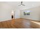 Light and bright bedroom with modern floors, ceiling fan, and easy access to the en-suite bathroom at 10619 W Sells Dr, Phoenix, AZ 85037