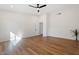 Spacious bedroom offers ample natural light from a ceiling fan and vinyl flooring at 10619 W Sells Dr, Phoenix, AZ 85037