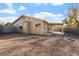 Home exterior featuring desert landscaping, an enclosed yard, and covered patio at 10619 W Sells Dr, Phoenix, AZ 85037