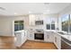 Recently renovated kitchen with granite counters, modern appliances, and an open layout at 10619 W Sells Dr, Phoenix, AZ 85037