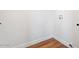 Laundry room features wood floors and white walls at 10619 W Sells Dr, Phoenix, AZ 85037