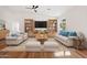 Bright and inviting living area with hardwood floors, modern furniture, and ample natural light at 10619 W Sells Dr, Phoenix, AZ 85037