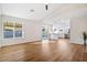 Bright living room featuring sleek hard surface floors, neutral paint, and an open concept design at 10619 W Sells Dr, Phoenix, AZ 85037
