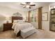 Relaxing bedroom with soft lighting, ceiling fan, neutral colors, and a comfortable bed at 15221 N Clubgate Dr # 1138, Scottsdale, AZ 85254