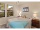 Cozy bedroom featuring ample natural light and a window with neighborhood views at 15221 N Clubgate Dr # 1138, Scottsdale, AZ 85254
