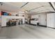 Spacious garage with abundant storage cabinets and a clean epoxy floor at 15221 N Clubgate Dr # 1138, Scottsdale, AZ 85254
