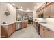 Modern kitchen featuring stainless steel appliances, wood cabinets and neutral countertops at 15221 N Clubgate Dr # 1138, Scottsdale, AZ 85254